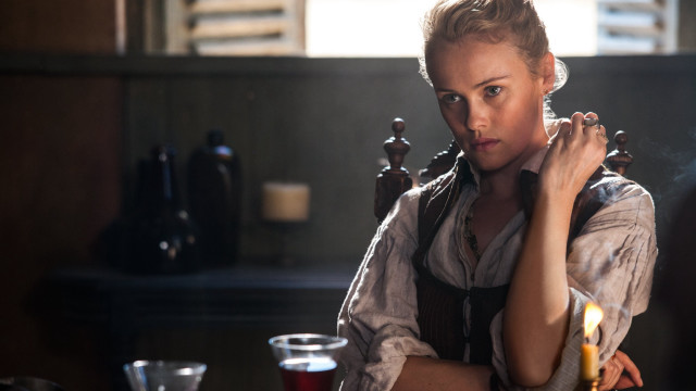 Woman sitting table candle hand free wallpaper for desktop - medium preview image