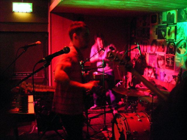 Band playing dimly lit room free wallpaper for desktop - medium preview image