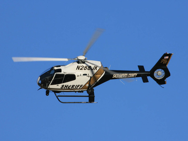 Helicopter flying blue sky propeller free wallpaper for desktop - medium preview image