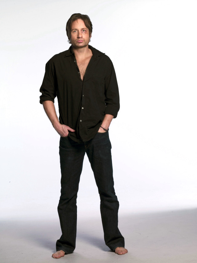 Man standing hands in pockets #2 free wallpaper for mobile - medium preview image