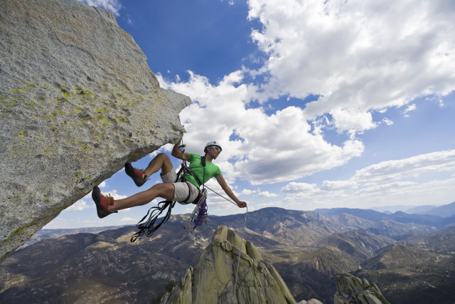 Man climbing mountain helmet rope free wallpaper for desktop - medium preview image