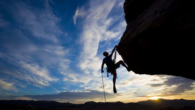 Man climbing cliff rope sky free wallpaper for desktop - medium preview image