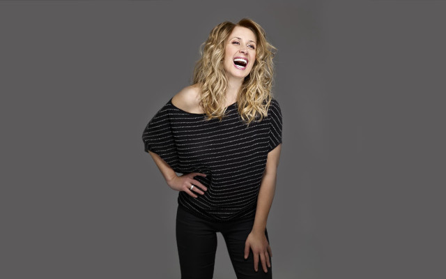 Woman laughing hands on hips free wallpaper for desktop - medium preview image