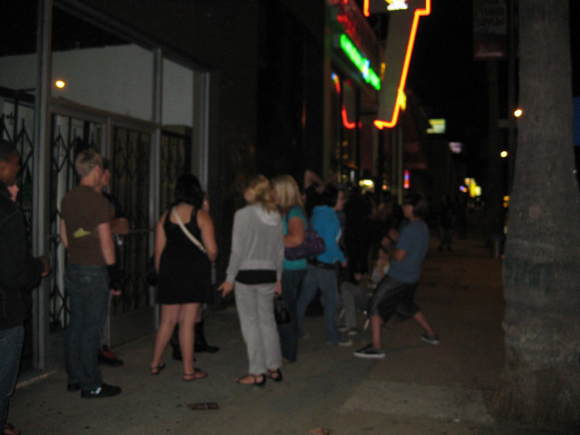 People sidewalk building night neon free wallpaper for desktop - medium preview image