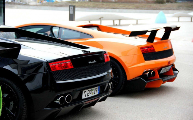 Orange black sports cars parked free wallpaper for desktop - medium preview image