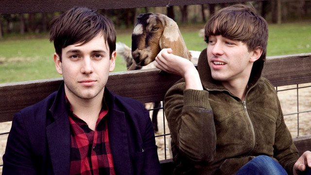 Young men bench goat behind free wallpaper for desktop - medium preview image