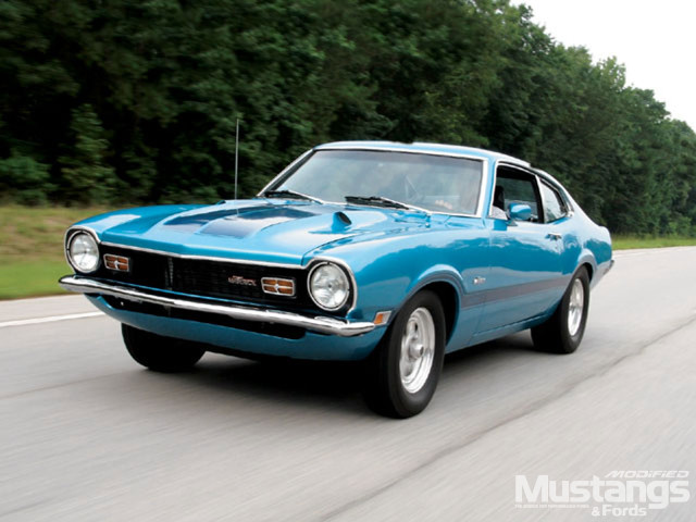 Blue muscle car driving road free wallpaper for desktop - medium preview image
