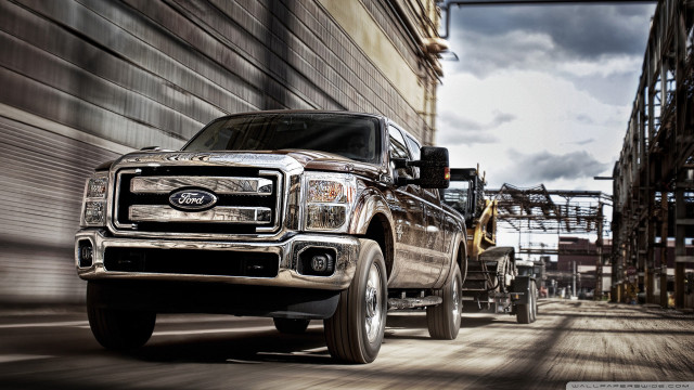 Truck driving street building construction free wallpaper for desktop - medium preview image