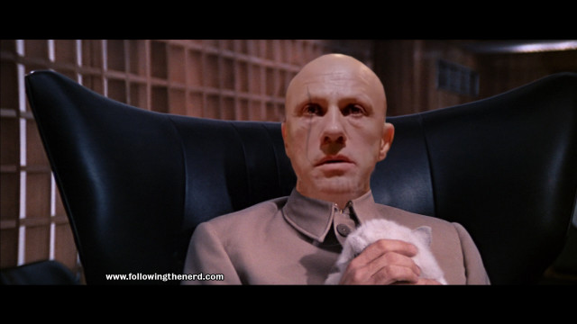 Bald man suit tie chair free wallpaper for desktop - medium preview image