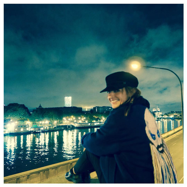 Woman sitting ledge water night free wallpaper for tablet - medium preview image