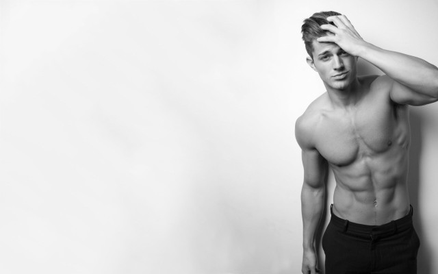 Muscular topless man holding head free wallpaper for desktop - medium preview image