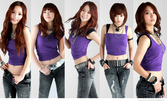Woman purple top jeans pose free wallpaper for desktop - medium preview image