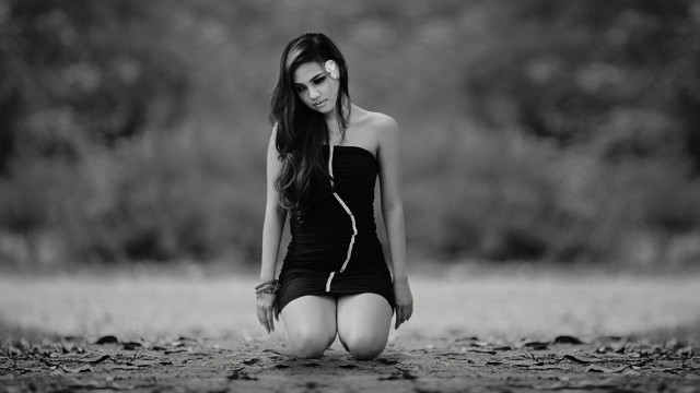 Woman black dress sitting blurry free wallpaper for desktop - medium preview image