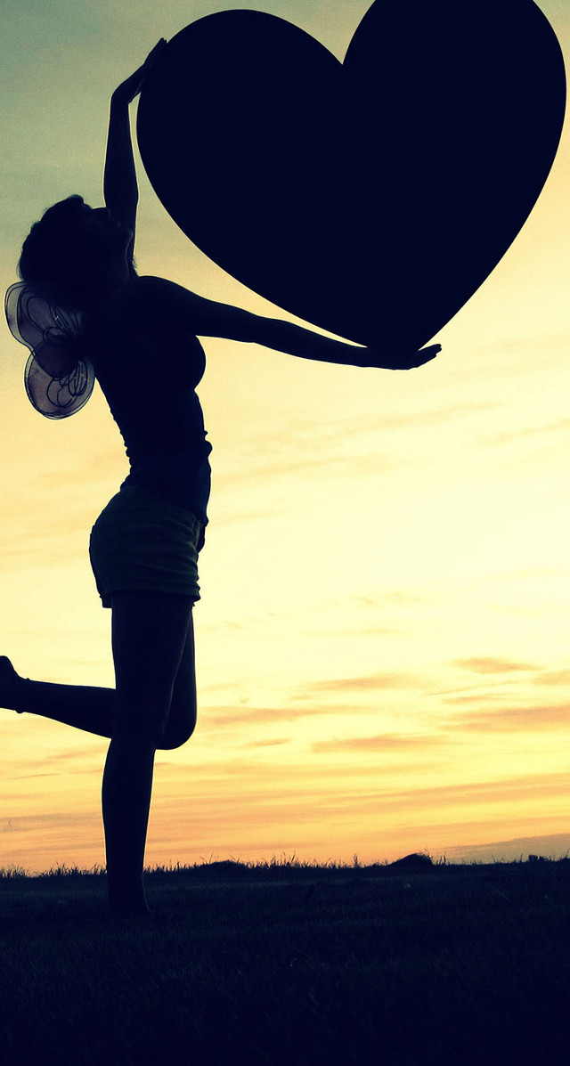 Woman holding heart sunset arms free wallpaper for mobile - medium preview image