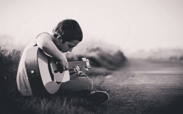 Young man guitar grass hands free wallpaper for desktop - medium preview image
