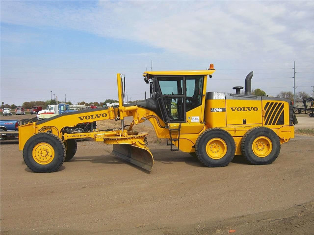 Yellow tractor parking lot snow free wallpaper for desktop - medium preview image