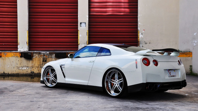 White sports car red garage free wallpaper for desktop - medium preview image