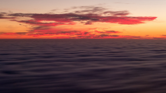 Sunset water clouds plane distance free wallpaper for desktop - medium preview image