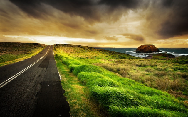 Lush green ocean road cloudy free wallpaper for desktop - medium preview image