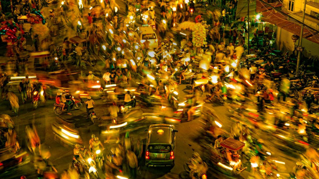 Nighttime street scene people riding free wallpaper for desktop - medium preview image