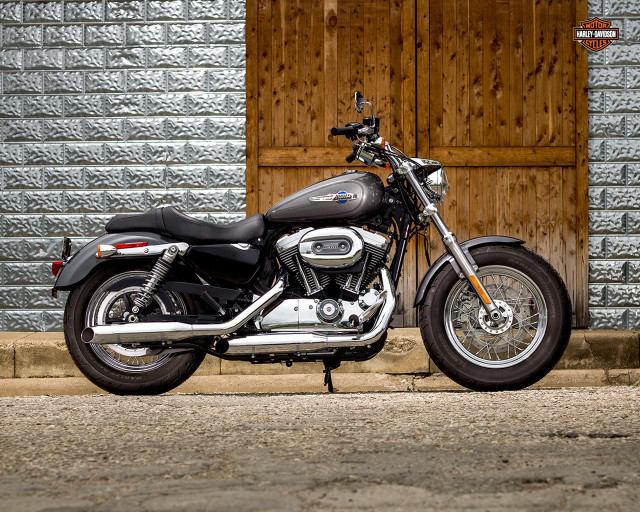 Motorcycle parked building wooden door free wallpaper for desktop - medium preview image