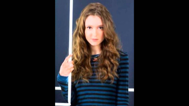 Woman thumbs up blue wall free wallpaper for desktop - medium preview image