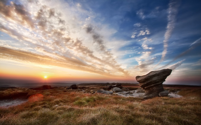 Rock formation grassy field sunset free wallpaper for desktop - medium preview image