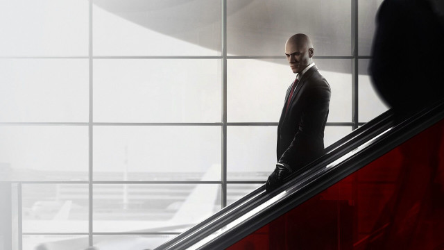 Man suit escalator airport terminal free wallpaper for desktop - medium preview image