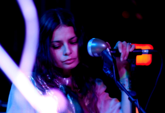 Woman holding microphone stand microphone free wallpaper for desktop - medium preview image