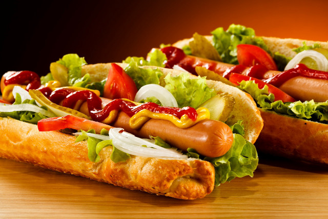 Two hot dogs with ketchup free wallpaper for desktop - medium preview image