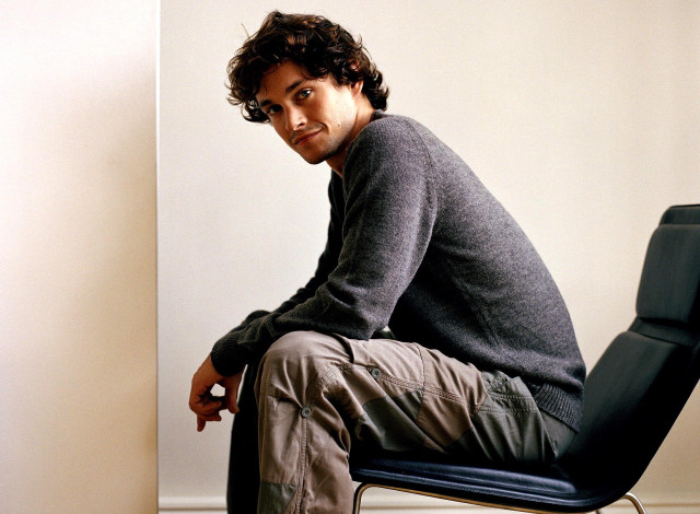 Man sitting chair room front free wallpaper for desktop - medium preview image