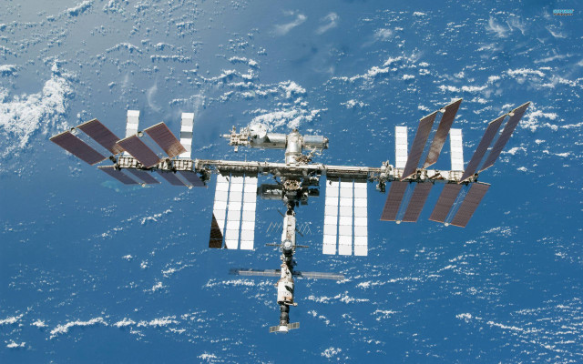 Space station ocean satellite attached free wallpaper for desktop - medium preview image