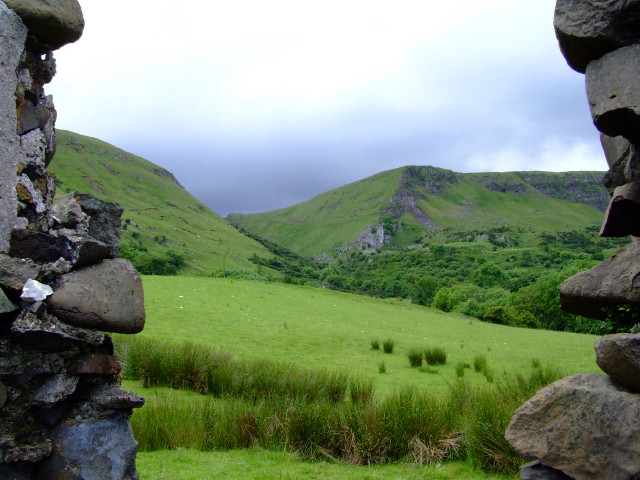 Grassy field stone wall mountain free wallpaper for desktop - medium preview image