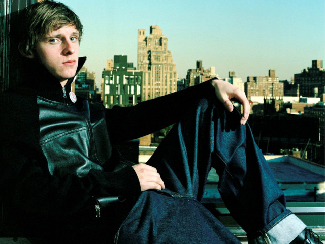 Man sitting rooftop cityscape leather free wallpaper for desktop - medium preview image