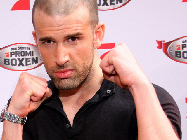 Bald man black shirt fists free wallpaper for desktop - medium preview image