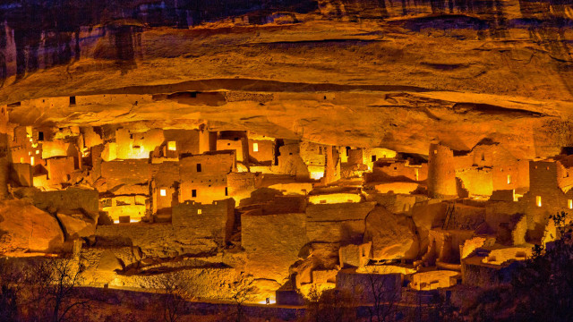 Cave lit buildings rocks nighttime free wallpaper for desktop - medium preview image