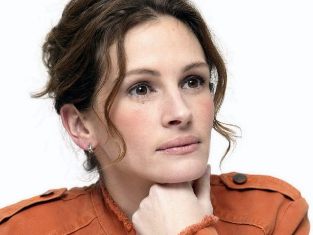 Woman brown jacket serious look free wallpaper for desktop - medium preview image