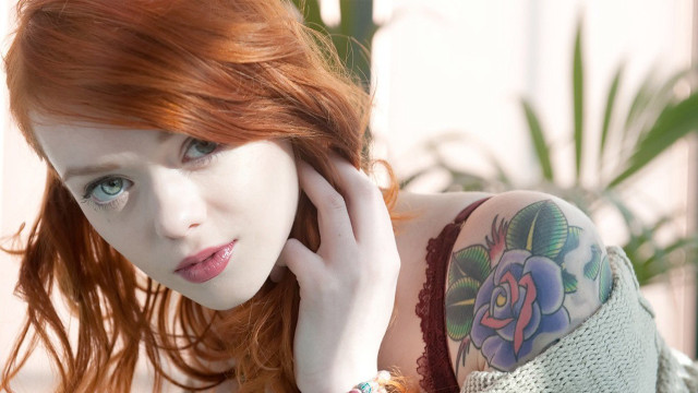 Red hair tattoos woman arm free wallpaper for desktop - medium preview image
