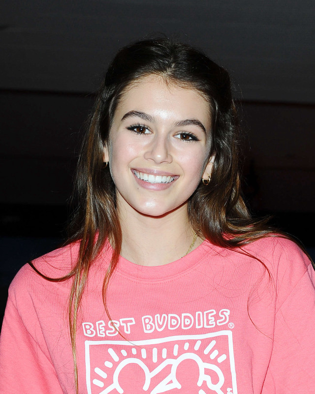 Girl pink shirt smiles camera free wallpaper for mobile - medium preview image