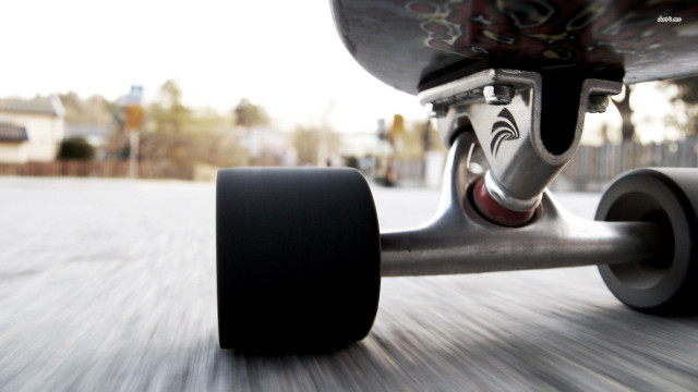 Skateboarder riding street black tire #2 free wallpaper for desktop - medium preview image
