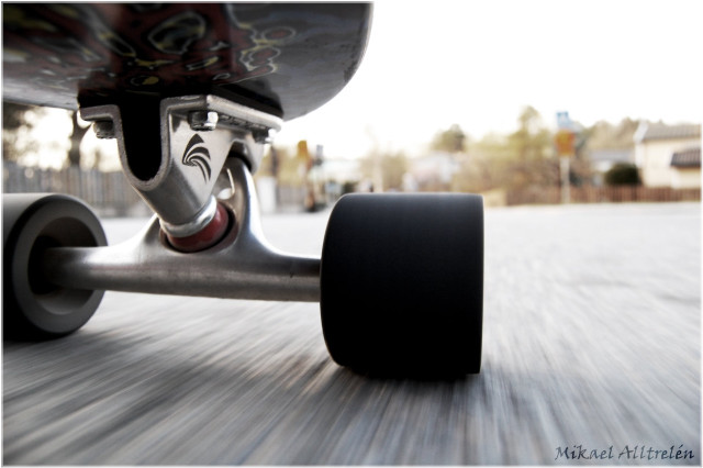 Skateboarder riding street black tire free wallpaper for desktop - medium preview image