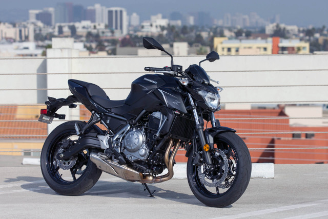 Black motorcycle parking lot city free wallpaper for desktop - medium preview image