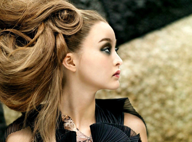 Woman ponytail black dress serious free wallpaper for desktop - medium preview image
