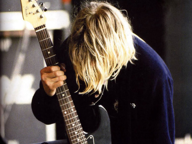 Man long hair holding guitar free wallpaper for desktop - medium preview image