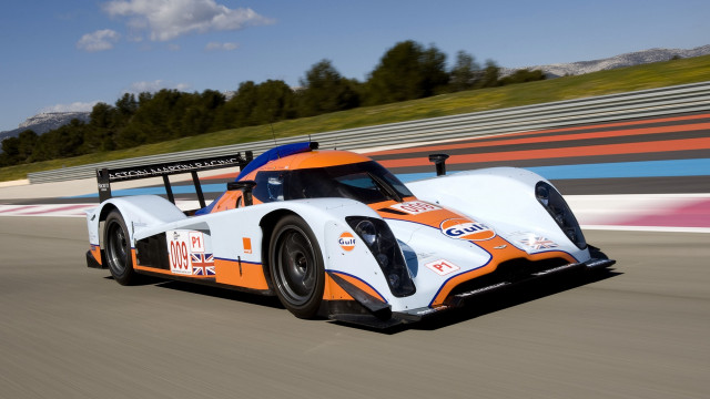 Race car track trees sky free wallpaper for desktop - medium preview image