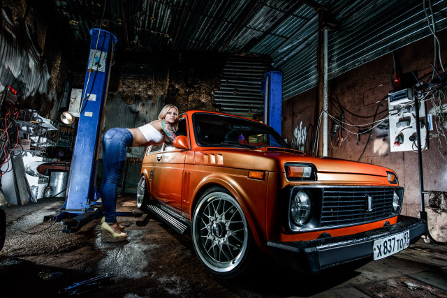 Man leaning truck garage punchingbag free wallpaper for desktop - medium preview image