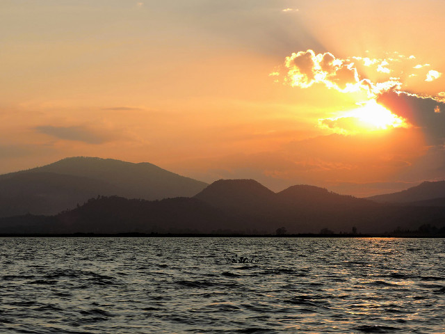 Sunset water mountains boat sunbeam free wallpaper for desktop - medium preview image
