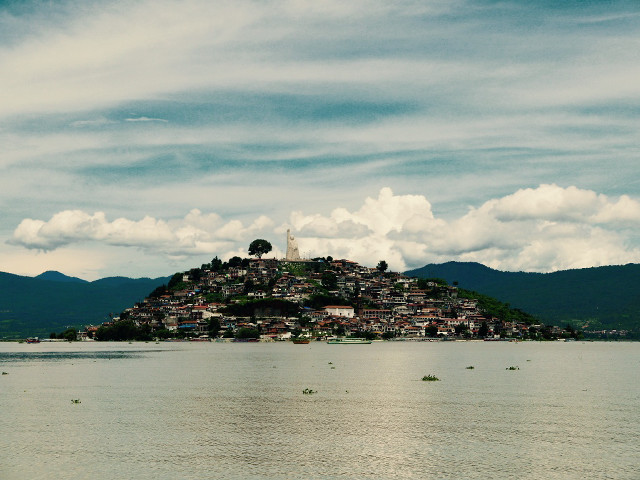 Small island village lake boat free wallpaper for desktop - medium preview image