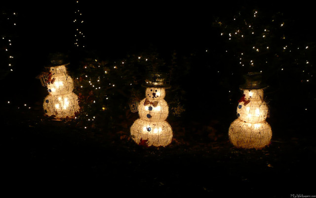 Snowmen lights dark trees background free wallpaper for desktop - medium preview image