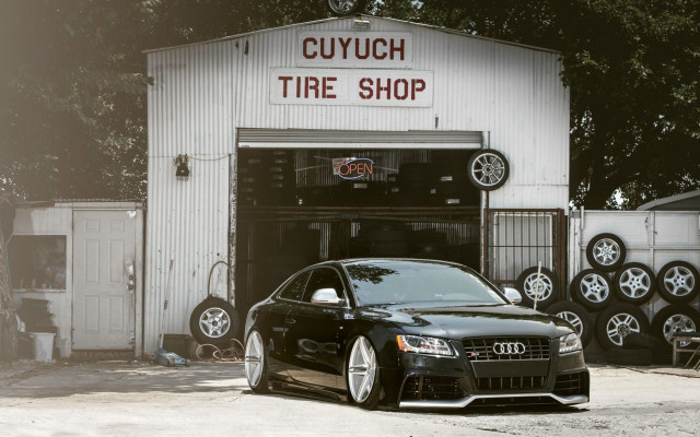 Black car tire shop night free wallpaper for desktop - medium preview image